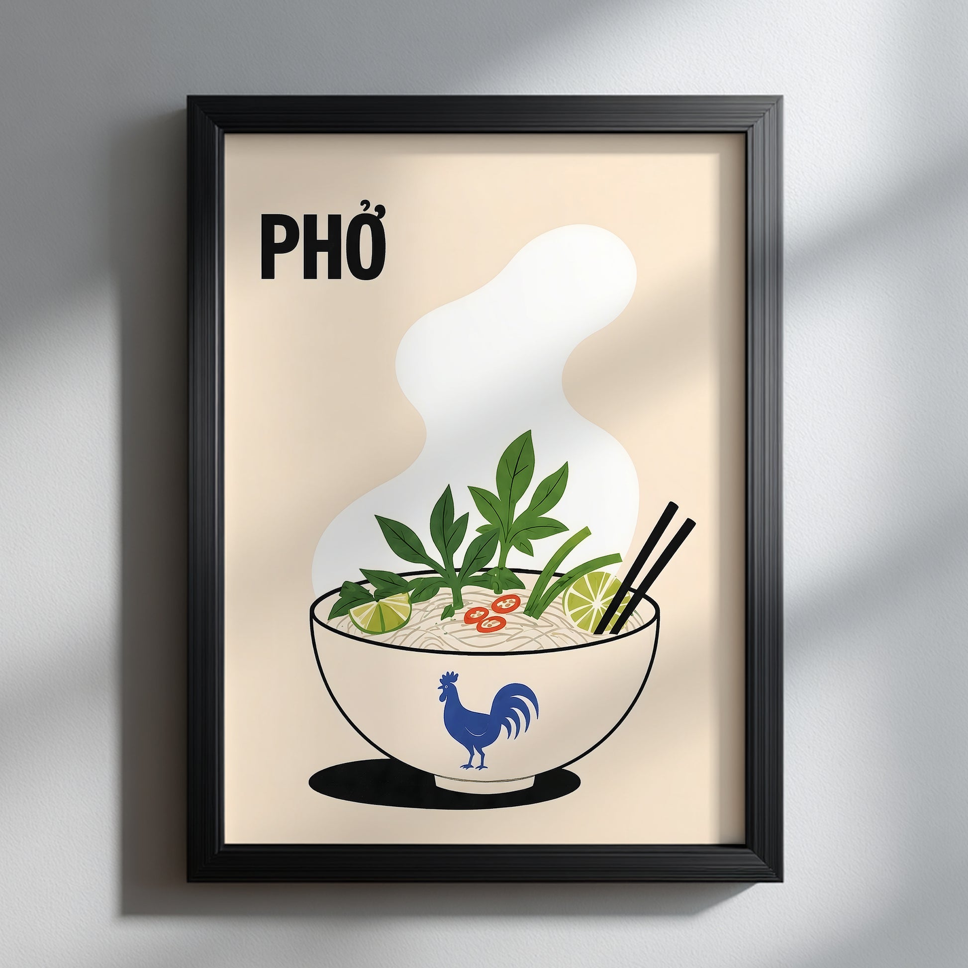 Vietnamese pho kitchen wall art displayed in a black frame on a pale wall with soft natural shadows. The illustrated noodle soup bowl includes green herbs, lime, red chilli, chopsticks and a blue rooster design.