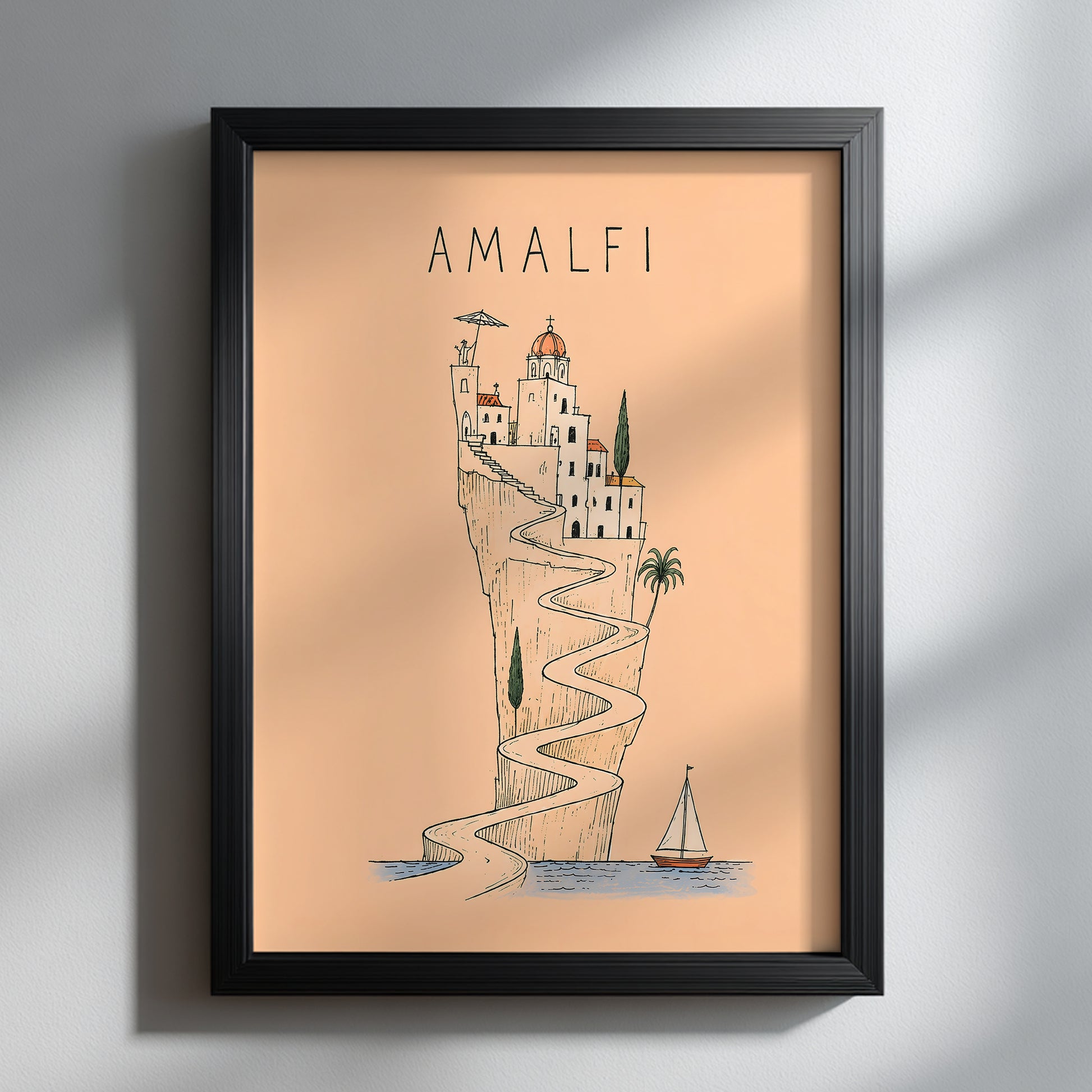 Amalfi Coast line art print displayed in a black portrait frame on a white textured wall, with natural sunlight and soft shadows highlighting the peach artwork.