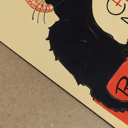 Close-up detail of the Tournée du Chat Noir print showing the paper texture and crisp black ink of the cat silhouette. The red typography and Art Nouveau design elements are visible at depth, highlighting the quality of this Steinlen vintage poster reproduction. Ideal for collectors seeking authentic French cabaret cat wall art with clear print definition.