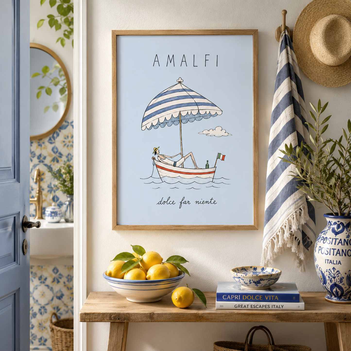 Framed Amalfi boat poster displayed above a wooden sideboard in a colourful Mediterranean-style interior with lemons, patterned ceramics, plants and blue decorative details.