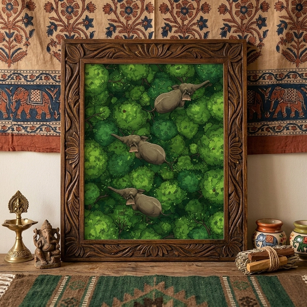Framed elephant wall art displayed above a desk against a patterned textile backdrop. The print shows three elephants walking through dense green jungle canopy seen from above, adding a bold natural focal point to the room. Styled with warm earthy decor for travel-inspired interiors, this mockup suits elephant poster, jungle wall art, wildlife print and tropical animal wall decor product listings.