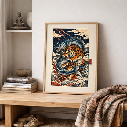 Japanese tiger and crashing wave wall art print styled on a wooden shelf with folded neutral textiles and ceramic décor. The bold orange tiger and flowing blue waves create strong contrast against a soft beige wall. Inspired by traditional ukiyo-e prints, this framed Asian wildlife artwork adds depth, movement and cultural character to the interior.