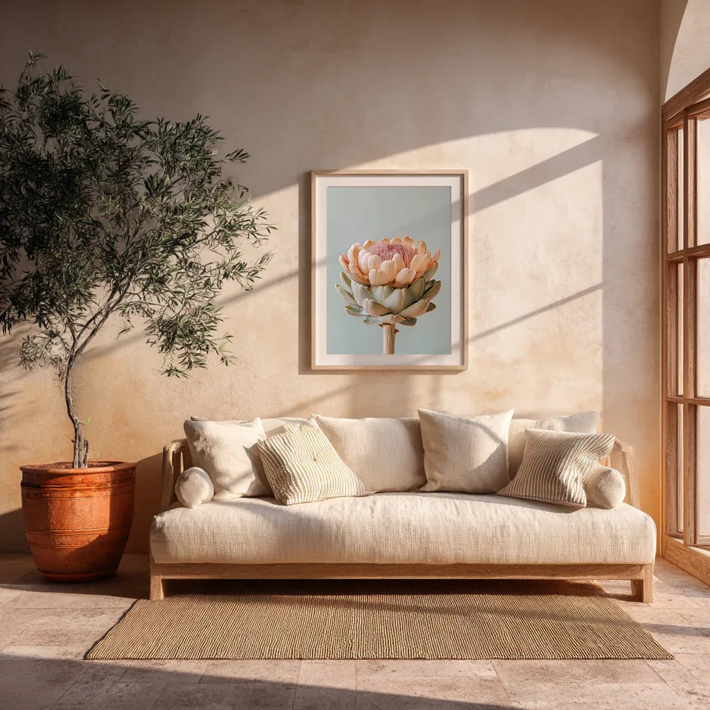 A pastel artichoke wall art print displayed in a modern living room with soft sunlight, neutral furnishings and natural materials. The warm décor highlights the artwork’s calming botanical tones and contemporary design.