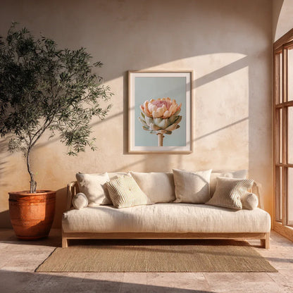 A pastel artichoke wall art print displayed in a modern living room with soft sunlight, neutral furnishings and natural materials. The warm décor highlights the artwork’s calming botanical tones and contemporary design.