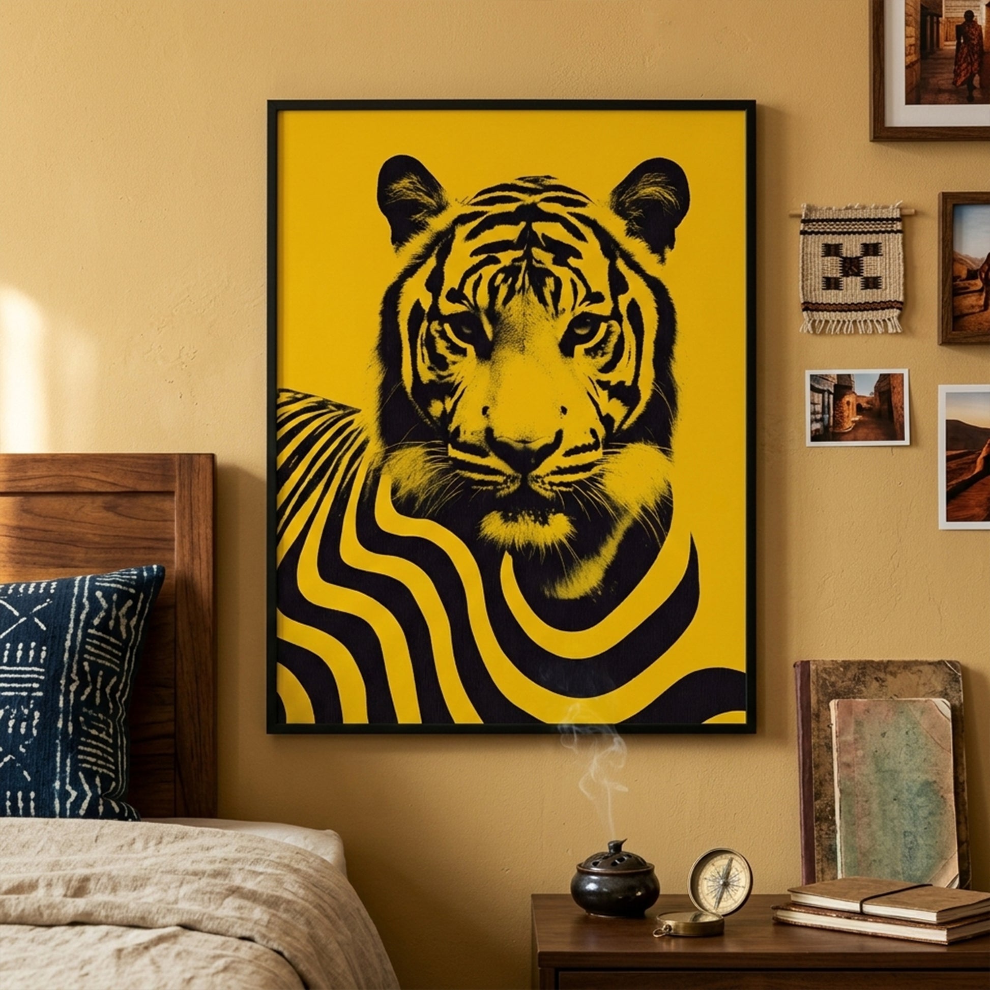 Modern living room scene with Malaysian tiger wall art displayed above a mantle surrounded by framed pictures and interior decor. The poster shows a bold black tiger portrait with graphic flowing stripes on a vibrant yellow background, creating a strong contemporary wildlife artwork inspired by Malaysia’s national animal and modern cultural poster design.