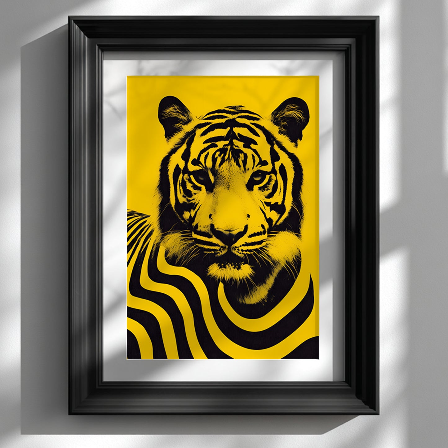 Framed Malaysian tiger wall art print displayed in a black picture frame against a clean white wall. The artwork features a bold black tiger portrait with flowing striped graphic patterns on a vibrant yellow background. Contemporary wildlife poster inspired by Malaysia’s national animal, combining modern pop art style, strong contrast and minimalist interior decor aesthetics.