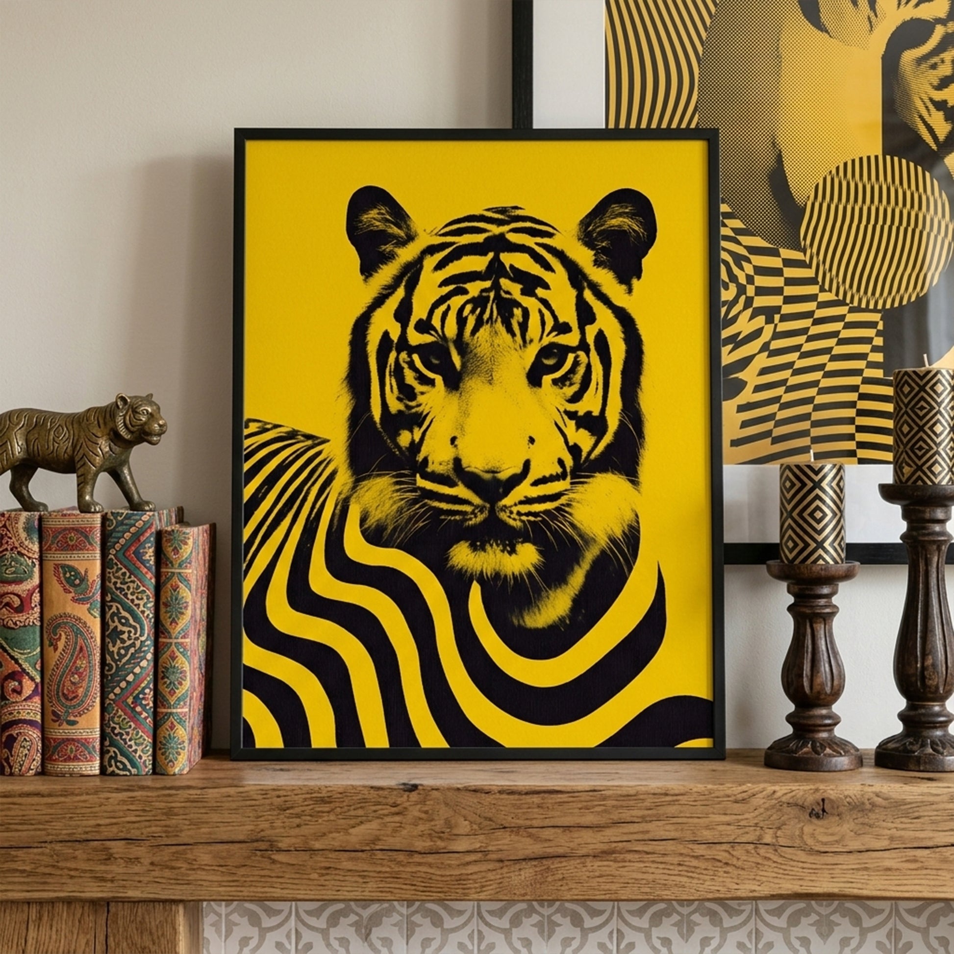 Malaysian tiger wall art poster styled on a living room mantle shelf with decorative books and interior accents. The artwork features a striking black tiger portrait with flowing striped patterns on a bright yellow background, creating a bold contemporary wildlife print inspired by Malaysia’s national animal and designed for modern home decor displays.