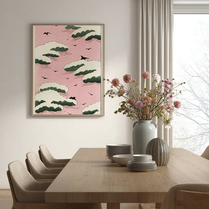 Shin Bijutsukai Japanese vintage print of a pink sky with white clouds and birds displayed in a minimalist dining room setting with neutral decor.