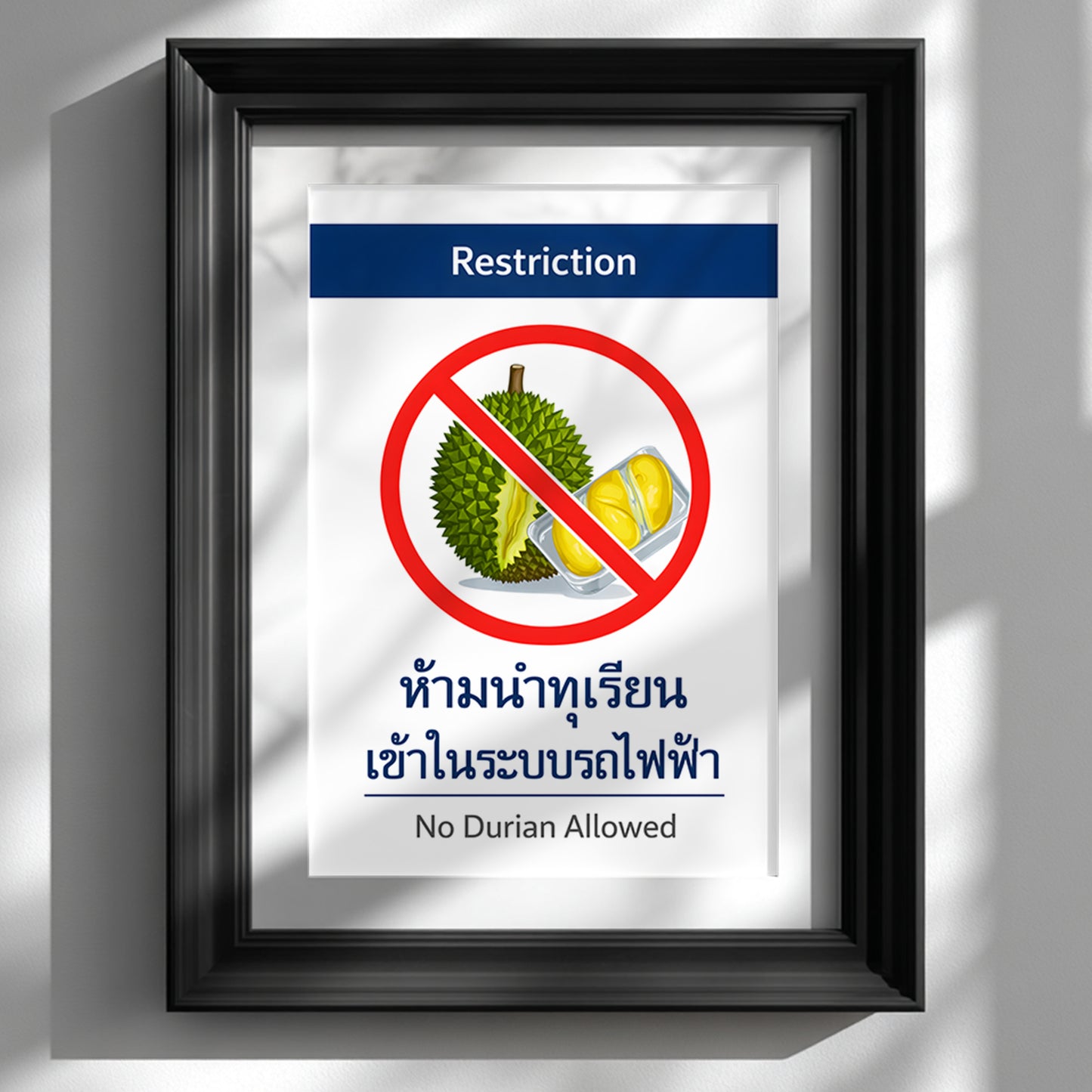 Framed No Durian Allowed poster inspired by Bangkok BTS and Thai metro system restriction signage, displayed in a black frame on a clean white wall. The minimalist bilingual prohibition sign features a bold red circle over a durian illustration with structured transport-style typography. A modern Southeast Asia travel memory print styled as graphic kitchen or hallway wall decor.