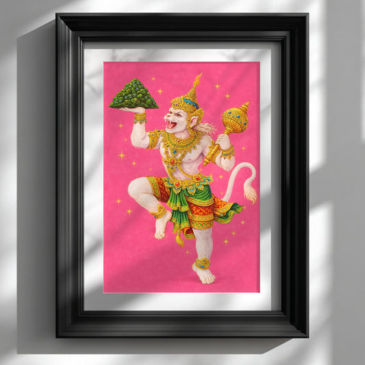Thai Hanuman Ramakien art print displayed in a black frame against a clean white wall. The vibrant pink background highlights the Hindu monkey god in traditional Thai costume with gold detailing and green accents, captured mid-dance. A bold spiritual mythology poster styled as contemporary wall decor, blending Southeast Asian folklore with modern interior presentation.