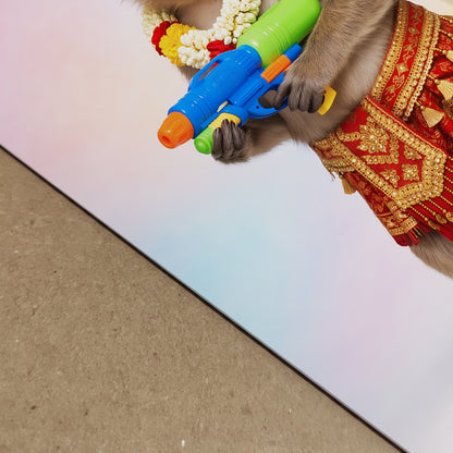 Close-up photo of the Thai Songkran Monkey print showing the paper edge, pastel background, and part of the monkey’s red and gold Thai outfit with the bright water gun. The angled view highlights print detail, surface finish and colour quality. Ideal supporting image for monkey print, Thai wall art, Songkran poster and premium art paper product listings.