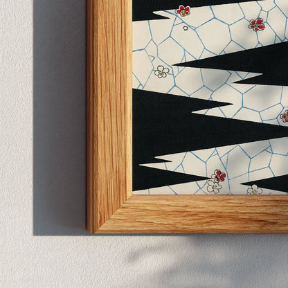 Close-up corner shot of a wooden frame featuring a black and cream abstract zigzag print. Modern geometric artwork captured in natural light, showing frame texture and design details.