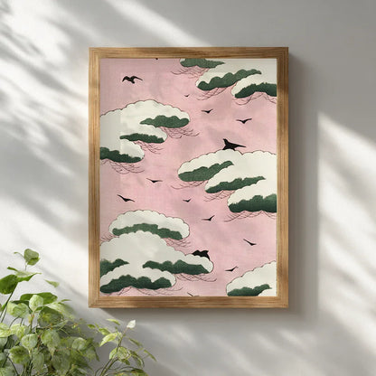 Japanese Shin Bijutsukai vintage art print showing pink sky, white clouds and birds framed in natural wood and hung on a white wall.